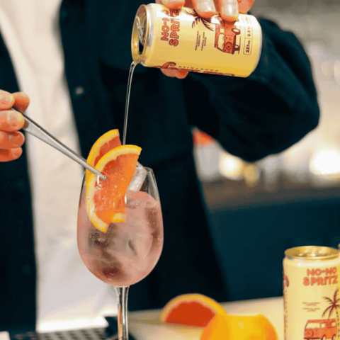 A can of No-No Spritz non-alcoholic cocktail being poured into a glass