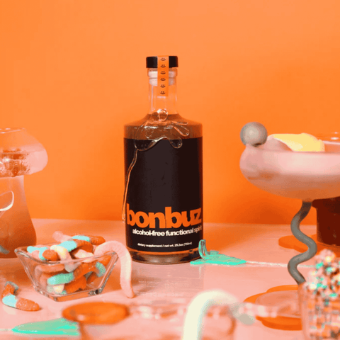 A bottle of Bonbuz non-alcoholic functional spirit displayed with cocktails