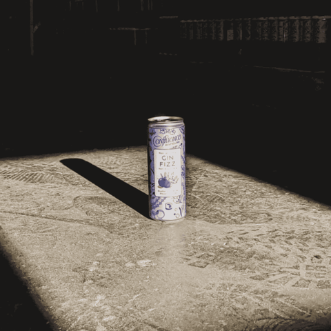 A can of Confluence Distilling Lavender Blueberry Non-Alcoholic Gin Fizz with moody lighting