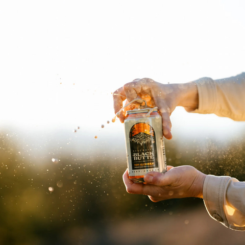 A can of Deschutes Black Butte Non-Alcoholic Porter Being Opened