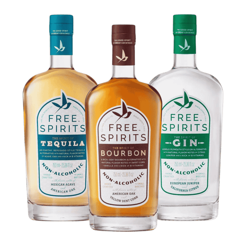 Three bottles of non-alcoholic spirits by Free Spirits. Bourbon, Gin, and Tequila.