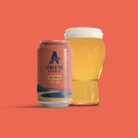 A can of Athletic Brewing Free Wave Hazy IPA non-alcoholic beer poured into a glass