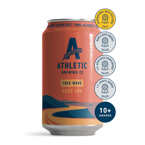 A can of Athletic Brewing Free Wave Hazy IPA with a red and orange design, featuring the Athletic Brewing logo and indicating the beverage is non-alcoholic with 10+ awards.