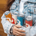 A person holding a collection of non-alcoholic drinks from Casa Pinata