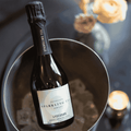 A bottle of Copenhagen LYSEGRØN Sparkling Tea 375 mL chilling in an ice bucket
