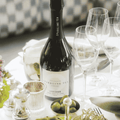 A bottle of Copenhagen LYSEGRØN Sparkling Tea served on a dinner table