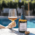 A bottle of Copenhagen LYSERØD Sparkling Tea served pool-side