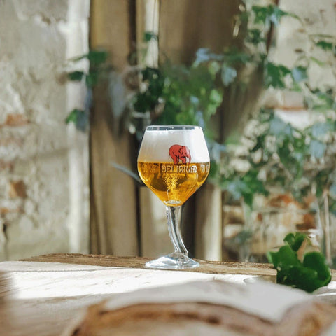 A branded glass of Delirium Belgian Beer with it's iconic pink elephant
