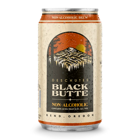 A can of Deschutes Black Butte Non-Alcoholic Porter beer with a mountainous landscape and sunset in the label design.