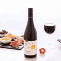 A bottle of Edenvale Expedition Series Tempranillo Cabernet Sauvignon non-alcoholic red wine paired with meats and olives