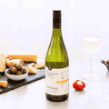 A bottle of Edenvale Expedition Verdejo Sauvignon Blanc non-alcoholic wine paired with cheese and olives