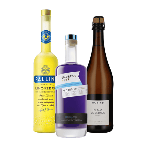 A bottle of Empress 1908 0.0 Indigo non-alcoholic gin, with a bottle of Limonzero non-alcoholic Limoncello, and sparklign wine
