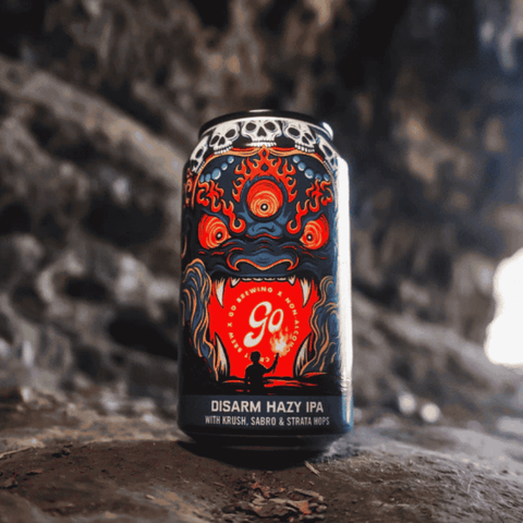 A can of Go Brewing Disarm non-alcoholic Hazy IPA displayed in a cave