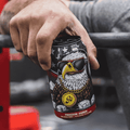 A person holding a can of Go Brewing Gluten-Free Non-Alcoholic Amber