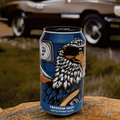 A can of Go Brewing Gluten-Free Non-Alcoholic Hazy IPA displayed on a rock with a vintage car in the background