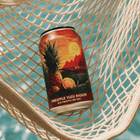 Can of non-alcoholic Pineapple Yuzu Radler by Go-Brewing on a hammock.