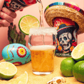 A can of Go Brewing non-alcoholic Salty Lime AF Chelada being poured into a glass with a salted rim