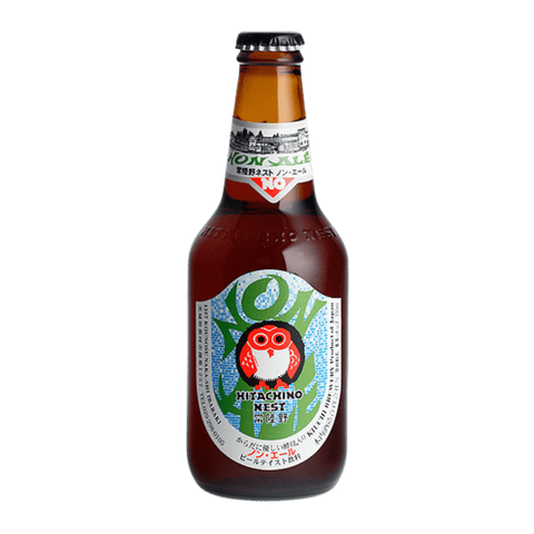 Bottle of Hitachino Nest beer with a colorful label featuring an owl on a white background