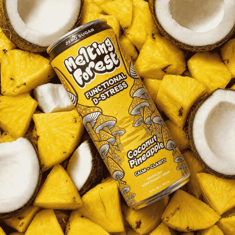 Can of 'Melting Forest' functional drink surrounded by pineapple and coconut pieces.