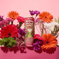 A can of Melting Forest Watermelon Elderflower D-Stress Functional Drink surrounded by a bouquet of flowers