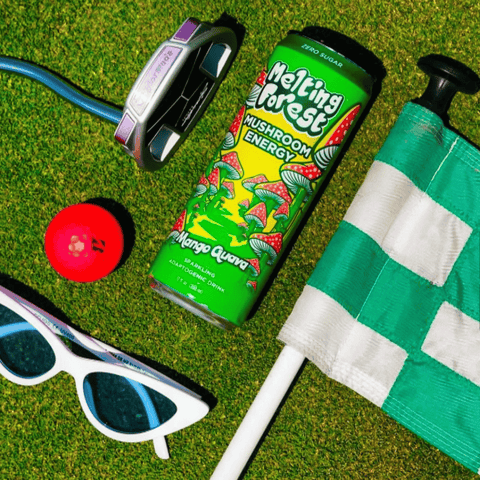 A can of Melting Forest Mango Guava Functional Energy Drink on a putting green