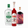 Three bottles of non-alcoholic spirits used to make a non-alcoholic Negroni; Free Spirits Gin, NOA Sweet Vermouth, and Bark & Bitter Novara
