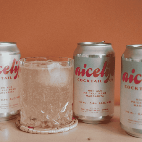 Three cans of NiceLife Cocktail Co. non-alcoholic Prickly Pear Margarita