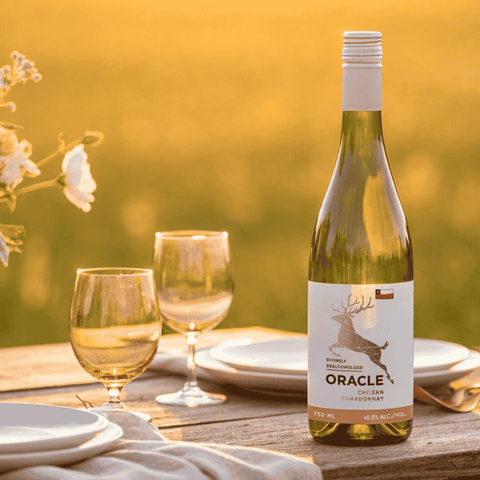 A bottle of Oracle non-alcoholic Chardonnay displayed on a harvest table