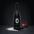 Bottle of Zero Non-Alcoholic Sake Origami on a dark background with a red origami crane.