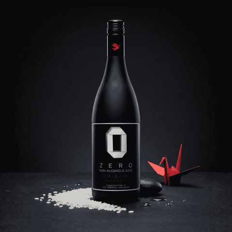 Bottle of Zero Non-Alcoholic Sake Origami on a dark background with a red origami crane.