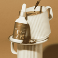 A bottle of MyCafé Hazelnut mushroom elixirs by Ananda Elixirs mixed into a coffee