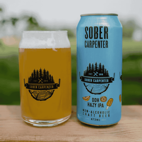 A can of Sober Carpenter's DDH Hazy IPA poured into a glass