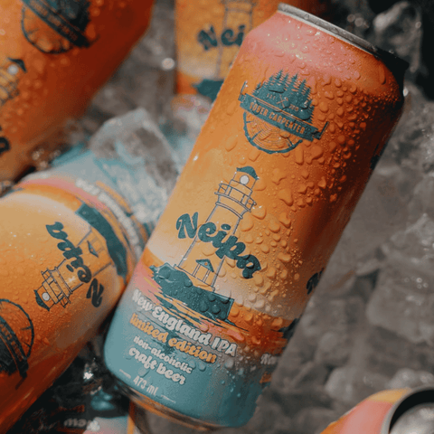 Cans of Sober Carpenter New England IPA non-alcoholic beer on ice.