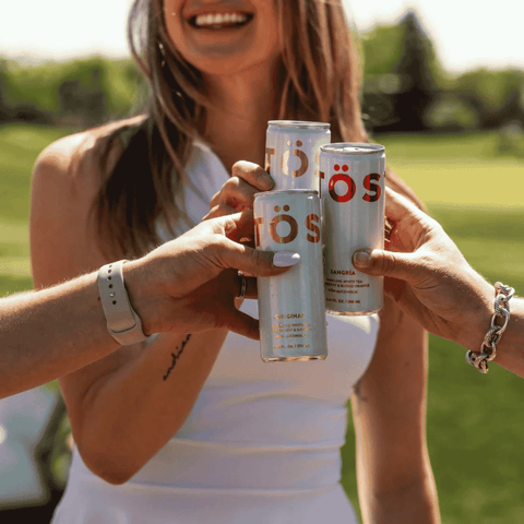 Three cans of TOST Sparkling Tea
