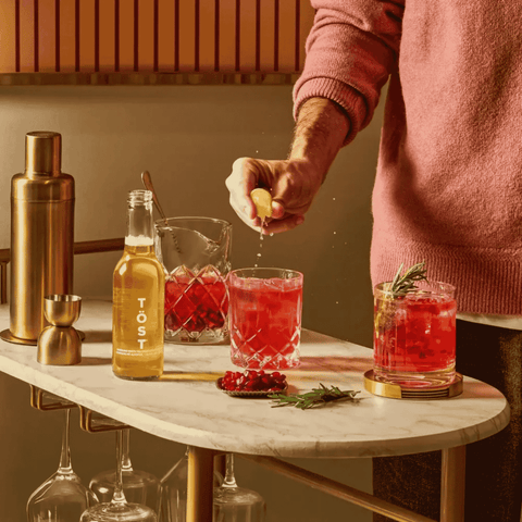 TOST Sparkling White Tea being prepared into a non-alcoholic cocktail